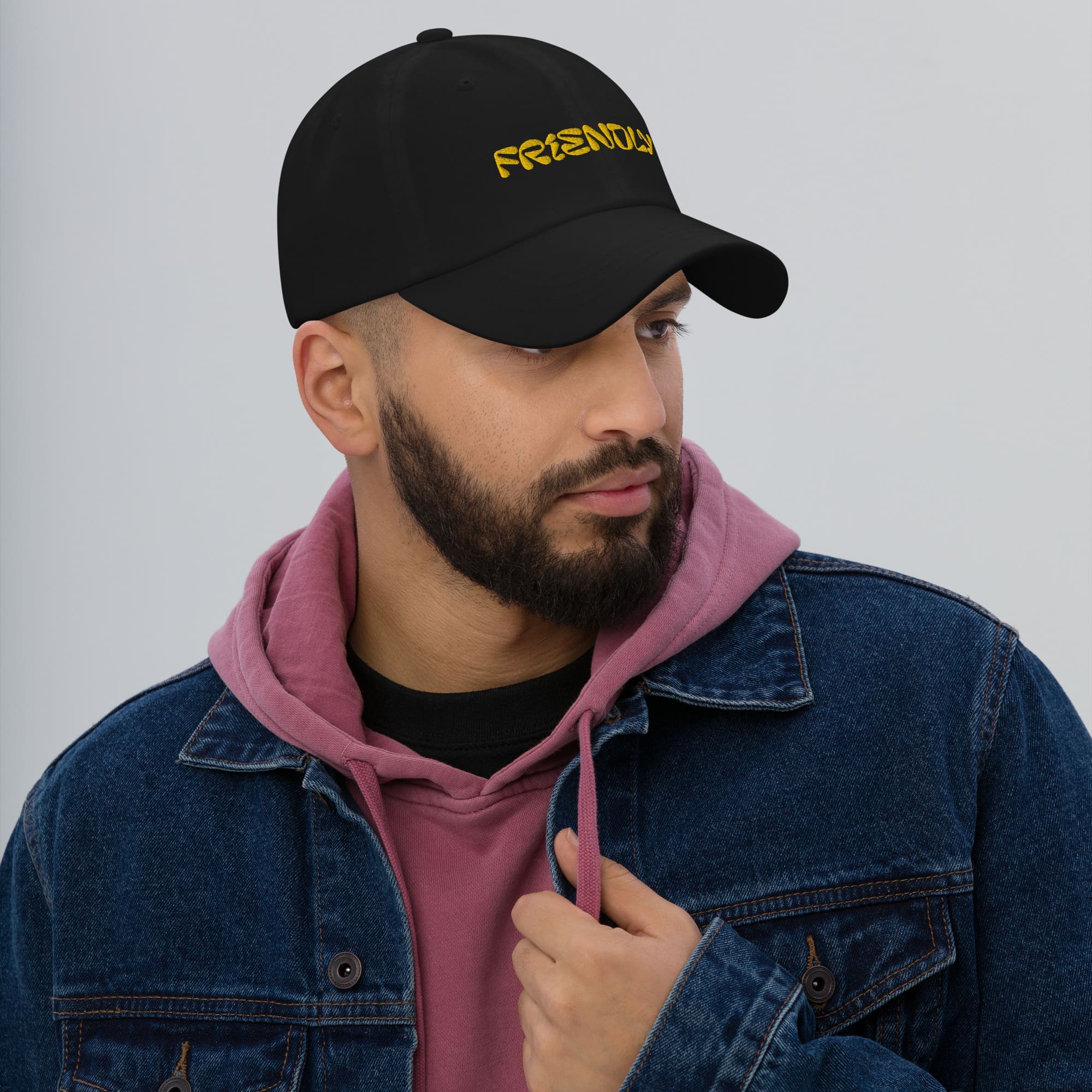 Male model wearing Black Friendly Dad Hat - Yellow